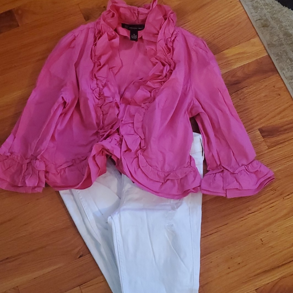 A pair of white ankle pants & a pink crop jacket